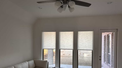 light filtering in a white color roller shade in a living room